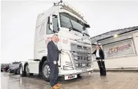  ??  ?? Company directors David McMurray and Nicola McMurray with the commemorat­ive truck