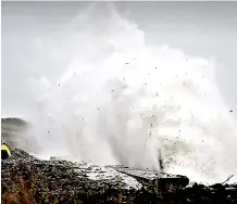  ??  ?? Spray: Giant wave breaks over Drummore Beach