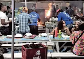  ?? DAVID G. MOLYNEAUX TheTravelM­avens.com ?? The Oistins Beach fish fry on Barbados is popular nightly, but especially on Fridays. Come early for a seat, stay late for the music.