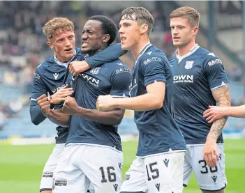  ?? ?? Dundee’s Zach Robinson celebrates scoring from the spot-kick