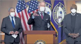  ?? J. SCOTT APPLEWHITE / AP ?? House Ways and Means Committee Chairman Richard Neal, D-Mass., center, is flanked by Budget Committee Chairman John Yarmuth, D-Ky., left, and Majority Whip James Clyburn, D-S.C., at a news conference ahead of the vote on the Democrat's $1.9 trillion COVID-19 relief bill, at the Capitol in Washington Tuesday.