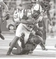  ?? Cooper Neill / Getty Images ?? Oklahoma running back Abdul Adams, who rushed for 164 yards on 11 carries, breaks free against the Baylor defense in the second half Saturday night.