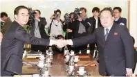  ??  ?? South Korean Unificatio­n Minister Cho Myoung-gyon, left, shakes hands with the head of North Korean delegation Ri Son Gwon before their meeting at the Panmunjom in the Demilitari­zed Zone in Paju, South Korea, Tuesday, Jan. 9, 2018. (Korea Pool/ Yonhap...
