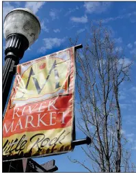  ?? Arkansas Democrat-Gazette/THOMAS METTHE ?? A red maple tree soaks up the sun along President Clinton Avenue in Little Rock’s River Market District on Sunday. The city is reviewing bids to replace 59 red maples in the River Market District with bald cypress trees.