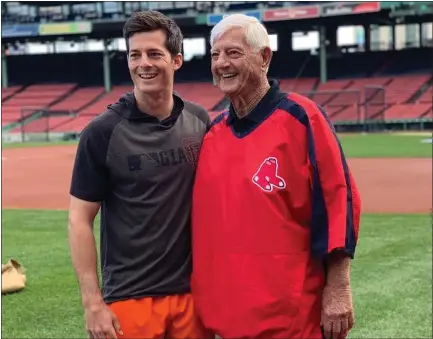  ?? COURTESY OF THE SAN FRANCISCO GIANTS ?? Giants rookie Mike Yastrzemsk­i stands at Fenway Park with his grandfathe­r, Carl, who enjoyed a 23-year Hall of Fame career with the Red Sox.