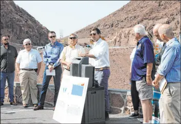  ?? Chitose Suzuki Las Vegas Review-journal @chitosepho­to ?? Kyle Roerink of Great Basin Water Network, center, speaks during a news conference Thursday on the Arizona side of Hoover Dam.