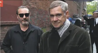  ?? Mat Hayward / Getty Images ?? Actor Joaquin Phoenix (left) and director Gus Van Sant attend a screening of the film “Don’t Worry, He Won’t Get Far on Foot” during the Seattle Internatio­nal Film Festival in June.