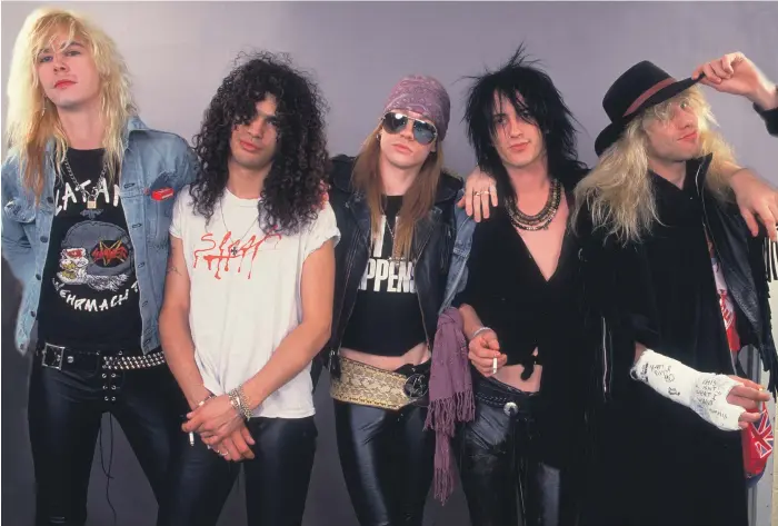  ??  ?? Guns N’ Roses, from left, Duff McKagan, Slash, Axl Rose, Izzy Stradlin and Steven Adler at the start of their career in 1987, the year they released their debut album