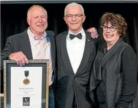  ??  ?? Tim, left, and Judy Finn with Sir George Fistonich and the Sir George Fistonich medal the Finns received as Legends of New Zealand Wine.