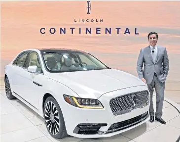  ?? EPA ?? Mark Fields, CEO of Ford Motor Co, stands for a photograph next to the 2017 Lincoln Continenta­l during the 2016 North American Internatio­nal Auto Show (NAIAS) in Detroit, Michigan on Tuesday.