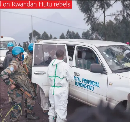  ?? Photo: Nampa/AFP ?? Tragic… A medical vehicle of the North Kivu hospital is loaded with the body of the driver on a road on the edge of the Virunga National Park near the village of Kibumba, some 25km from Goma, where Italy’s ambassador to the Democratic Republic of Congo, his bodyguard and driver were killed earlier.