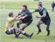  ?? PHOTO: PHIL JANSSEN ?? Bring him down . . . Maheno No 8 Hayden Tisdall tries to hold off Valley flanker Cameron Rowland during the Citizens Shield game at Weston last month. Maheno flanker Marcus Balchin is in support.