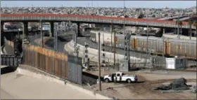  ?? AP PHOTO/ERIC GAY ?? A new barrier is built Jan. 22 along the Texas-Mexico border near downtown El Paso. Such barriers have been a part of El Paso for decades and are currently being expanded, even as the fight over President Donald Trump’s desire to wall off the entire U.S.-Mexico border.