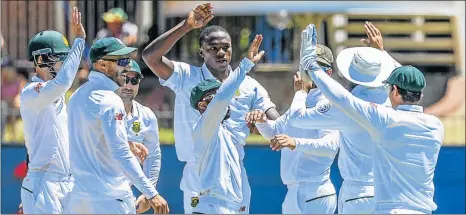  ?? Picture: GALLO IMAGES ?? HIGH-FIVES ALLROUND: The Proteas celebratin­g with Kagiso Rabada after he claimed a wicket during the Boxing Day Test against Sri Lanka in Port Elizabeth last year. Rabada and the team will be back at St Georges this year after the four-day day-night...