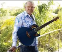  ??  ?? In this July 27, 2011, photo, musician Glen Campbell poses for a portrait in Malibu, Calif.