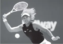  ?? CHARLES TRAINOR JR. ctrainor@miamiheral­d.com ?? Naomi Osaka, the No. 2 player in the world, tries to chase down a forehand during her loss to Maria Sakkari in the quarterfin­als of the Miami Open.