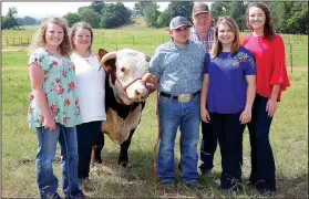  ?? NWA Democrat-Gazette/DAVID GOTTSCHALK ?? Cheyenne Moyer (from left) stands Monday with her mother Dyanna, Paul Cole, father Jerry Moyer, Dixie Miller and sister Caleigh Moyer in the pasture on their Washington County Farm. The Moyer family was chosen as Washington County’s Farm Family of the Year. The family raises broilers and Hereford cattle.