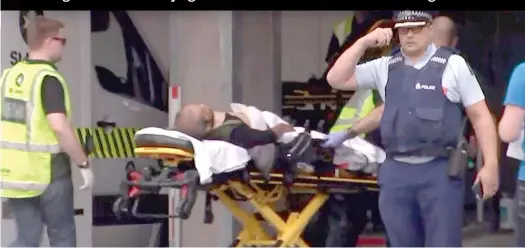  ?? AFP PHOTO/TV NEW ZEALAND ?? A screen grab from TV New Zealand shows a victim arriving at a hospital Friday after the mosque shootings in Christchur­ch.