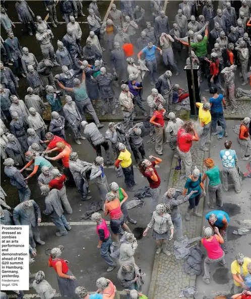  ?? Friedemann Vogel / EPA ?? Prostester­s dressed as zombies at an arts performanc­e and demonstrat­ion ahead of the G20 summit in Hamburg, Germany, yesterday.