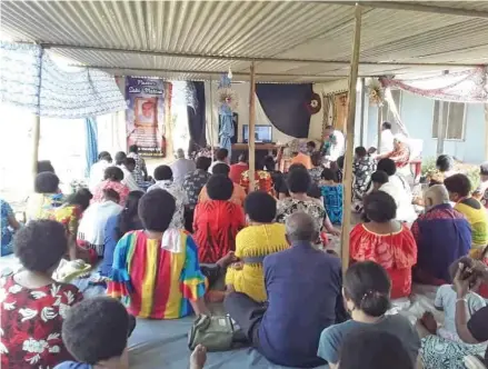  ?? Photo: Laisa Lui ?? Family members and fellow mourners in Labasa view the livestream of the funeral of Pastor Saki Matana in New Zealand.