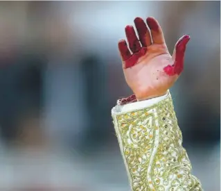  ?? VICTOR FRAILE / REUTERS ?? The catharsis of a real blood sport: A matador celebrates a kill at a bullfight in northern Spain.