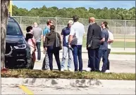  ?? Ron Blum / Associated Press ?? Yankees pitcher Gerrit Cole (backwards cap) talks with free agent reliever Andrew Miller and union head Tony Clark, right, as players arrive for labor negotiatio­ns with Major League Baseball on Saturday at Roget Dean Stadium in Jupiter, Fla.