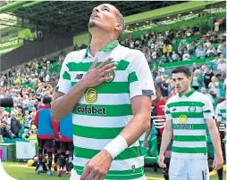  ??  ?? Christophe­r Jullien walks on to the Celtic Park turf for his first match-day experience