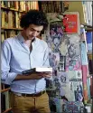 ?? AP/RUSSELL CONTRERAS ?? Marco P. Cremasco, 28, of Sao Paulo, Brazil, browses through Downtown Books, located on the iconic Route 66 in Albuquerqu­e, N.M.