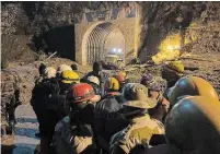  ?? RISHABH R. JAIN THE ASSOCIATED PRESS ?? Indo Tibetan Border Police personnel using heavy machinery to clear debris as they try to rescue more than three dozen power plant workers trapped in a tunnel.