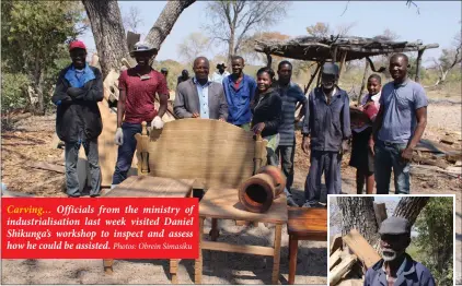  ?? Photos: Obrein Simasiku ?? Carving… Officials from the ministry of industrial­isation last week visited Daniel Shikunga’s workshop to inspect and assess how he could be assisted.