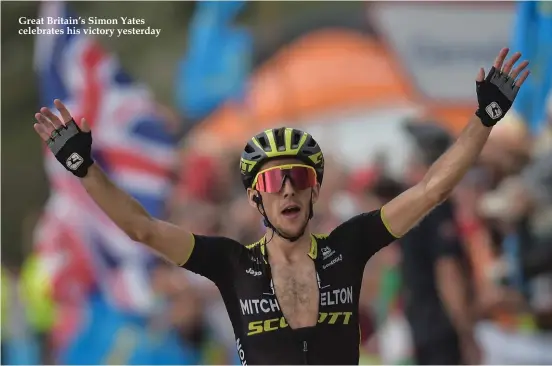  ??  ?? Great Britain’s Simon Yates celebrates his victory yesterday