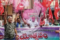  ?? Mahesh Kumar A. / Associated Press ?? Activists celebrate Friday after India Prime Minister Narendra Modi announced he would reverse controvers­ial farming laws.