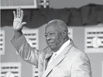  ?? GROLL/AP
MIKE ?? Hall of Famer Hank Aaron waves to the crowd during Baseball Hall of Fame induction ceremonies in Cooperstow­n, N.Y., on July 28, 2013.