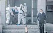  ?? AFP ?? ■
A patient being taken to Jinyintan hospital in Wuhan.