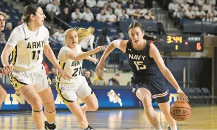  ?? PAUL W. GILLESPIE/CAPITAL GAZETTE ?? Navy’s Bianca Coleman drives against Army in the first quarter on Saturday. The Mids played well but ultimately lost 66-64.