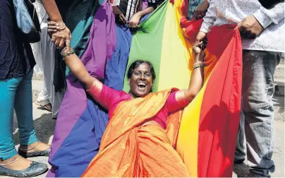  ?? PHOTO: REUTERS ?? Delight . . . An activist from the lesbian, gay, bisexual and transgende­r community celebrates after the Indian Supreme Court’s verdict decriminal­ising gay sex and revoking the section 377 law, in Bengaluru, India, on September 6.