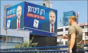  ?? Jack Guez AFP/Getty Images ?? A BILLBOARD bears Lieberman’s image in Tel Aviv. The maverick politician has managed to upend Netanyahu’s alliance with the ultra-Orthodox.