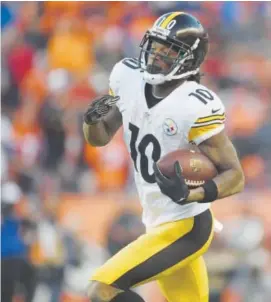  ?? Helen H. Richardson, The Denver Post ?? Pittsburgh Steelers wide receiver Martavis Bryant picks up yardage in a 23- 16 playoff loss to the Broncos on Jan. 17.