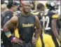  ?? FRED VUICH — THE ASSOCIATED PRESS FILE ?? In this file photo, Pittsburgh Steelers linebacker James Harrison walks the sidelines as his team plays against the Jacksonvil­le Jaguars in an NFL football game in Pittsburgh. The New England Patriots signed Harrison, Tuesday after he was released on...