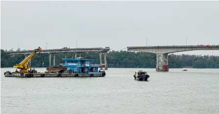  ?? — AFP photo ?? A general view shows a section of the collapsed Lixinsha bridge over a waterway in Guangzhou, in southern China’s Guangdong province.