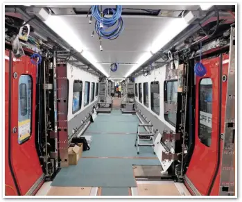  ??  ?? No seats are yet fitted to the first bi-mode for testing. On-board 755401 in Erlen on May 3, the trains have open gangways, with one set of doors per coach.