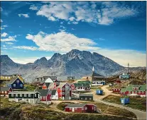  ?? ISTOCK ?? Explore the Arctic and idyllic villages in Greenland rather than Norway.