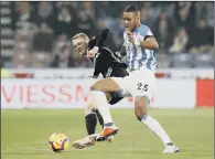  ?? PICTURE: MARTIN RICKETT/PA ?? UP FOR THE BATTLE: Huddersfie­ld Town’s Mathias ‘Zanka’ Jorgensen challengin­g Fulham’s Andre Schurrle.