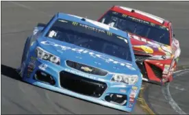  ?? RALPH FRESO — THE ASSOCIATED PRESS ?? Kyle Larson (42) drives out of Turn 4 ahead of Kyle Busch during the NASCAR Cup Series auto race at Phoenix Internatio­nal Raceway, Sunday in Avondale, Ariz. Larson finished second in the race.