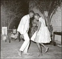  ?? CONTRIBUTE­D ?? Sidibe Malick was an obscure commercial photograph­er working in Mali until Western art experts discovered his work in the 1990s. This photograph of a young couple on Christmas Eve in 1963, one of his most famous, is part the pop-up exhibit “The Women,”...