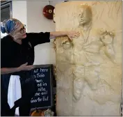  ?? CHRIS RILEY — THE TIMES-HERALD VIA AP ?? Catherine Pervan, with Our House Bakery in Benicia talks about creating the life-sized Han Solo on Thursday. The piece is the bakery’s entry in the downtown Benicia scarecrow contest.