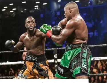  ?? Photo: RYAN HAFEY/PBC ?? BRUISING: Wilder tags Ortiz in their wild first encounter