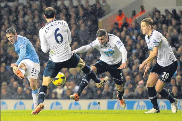  ?? Picture: Getty Images. ?? Stevan Jovetic fires in Manchester City’s fourth goal during last night’s 5-1 win over Tottenham at White Hart Lane.