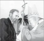  ?? Arturo Mari European Pressphoto Agency ?? LANDMARK MEETING Castro greets Pope John Paul II for a Mass in Havana in 1998.