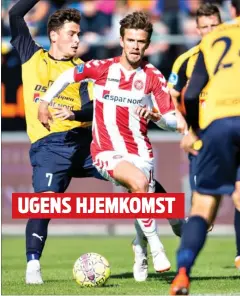  ?? FOTO: HENNING BAGGER ?? Lucas Andersen, der skal vaere med til at genrejse AaB, går elegant forbi to Hobro-spillere.